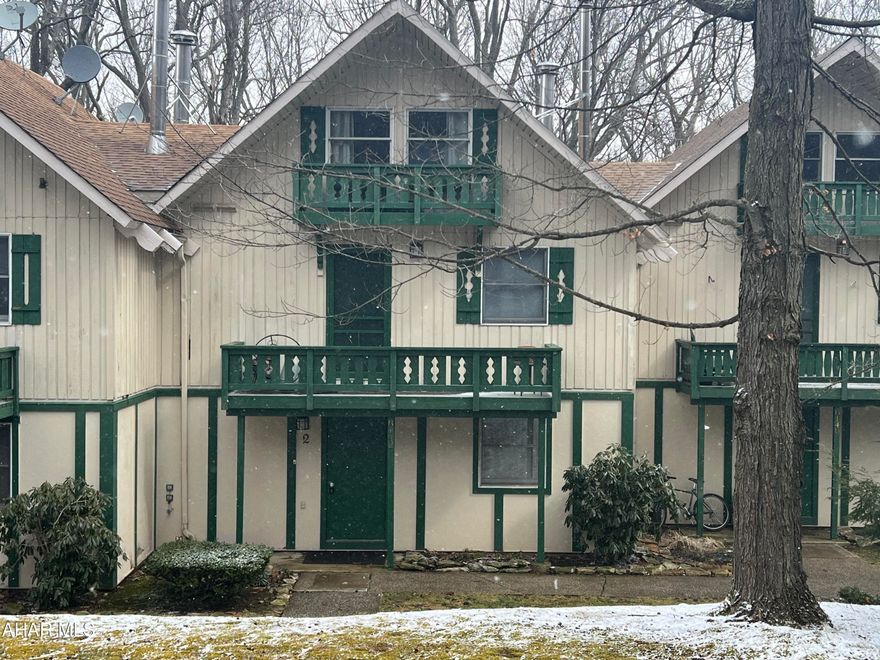 Charming updated condo completely furnished. One of the few that have a washer and dryer.  Mini split for heat and AC. Open, updated kitchen and living room offers vaulted ceiling. Living room has a cozy wood stove. Enjoy the rear deck that looks out over the wooded mountainside. HOA dues include outside maintenance, snow removal, lawn care, trash removal, use of pool and tennis count. Close to many activities that Blue Knob has to offer, including the ski resort, golf course, hiking and biking trails.