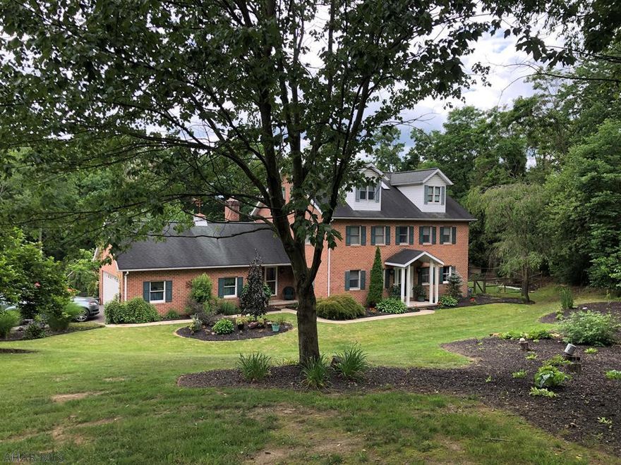 Check out the new photos!!  Highly Motivated Seller!!  Your Private Sanctuary!  Wonderful indoor & outdoor living space!  Spacious yet cozy family home 5BR, LR, Kitchen & Dining Combo, FR, Office, half BA, 3 Full 2 Half Baths, 2 car  , fenced yard, pond, hot tub, swimming pool, pool house w/bath, large covered patio, garden.  4 Zone Hot water heat, central air & central vac.  Plenty of closet space and storage.  Perfect location - Elmwood/Hollidaysburg Schools. Full Basement finished space is a large carpeted rec room -29'3" X 22'4", Exercise room 14'7" X 14'7" half bath and two utility rooms, plus walk out (Bilco Doors) to back yard.  Convenient location 5 minutes from everything.