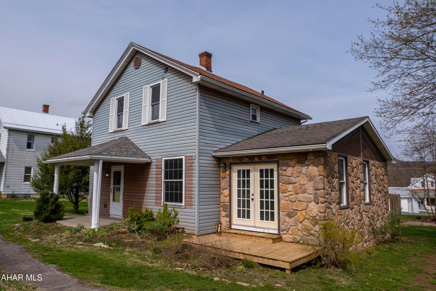 Nestled on a spacious corner lot with an additional parcel included, this three-bedroom, two-bath home offers an expansive footprint and incredible value for those looking to build 'sweat equity.' The main floor is designed for functional living, featuring an eat-in kitchen with a dedicated pantry, a large family room, and a formal living room that opens onto a walk-out deck perfect for outdoor entertaining. For ultimate convenience, the first-floor bathroom doubles as a laundry room, while the second full bath is located on the upper floor to serve the bedrooms. Throughout the home, you'll find a mix of classic hardwood and durable laminate flooring. While the property needs a little TLC to reach its full aesthetic potential, it remains completely move-in ready, making it the perfect canvas for a buyer who wants to personalize their space while living comfortably from day one. Schedule your tour today.