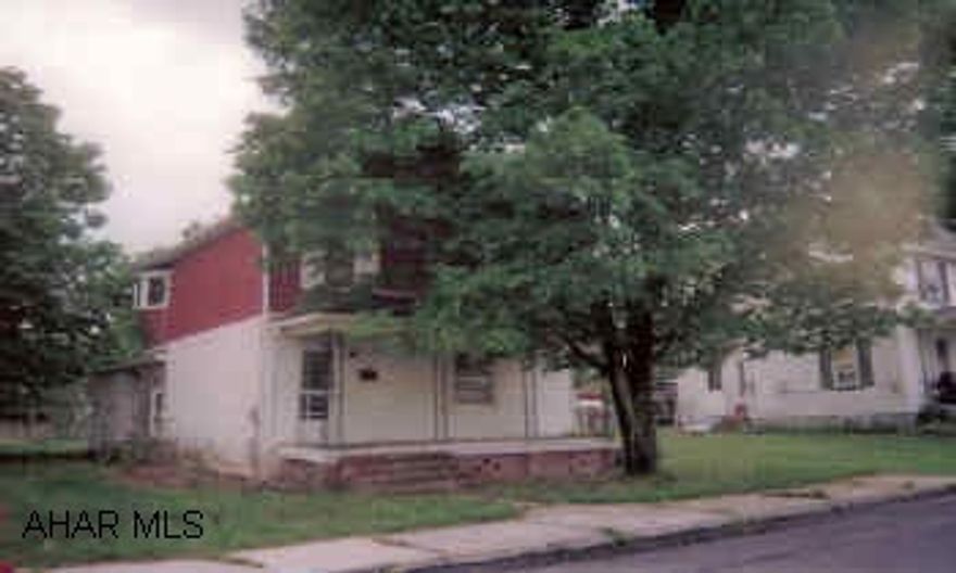 Two-Story tha needs work, but has potential. Front and rear porches. Back yard with garden space.