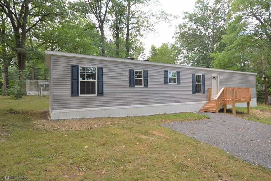 Super nice brand new single wide mobile home on rented lot in Hillcrest Estates in Greenwood.  Affordable living in a community with treed lots.  Seller incentive offers first and sixth month  lot rent for free.  Home comes with a One and a half year warranty.  Lot rent $299.10 includes water, sewer, trash removal.