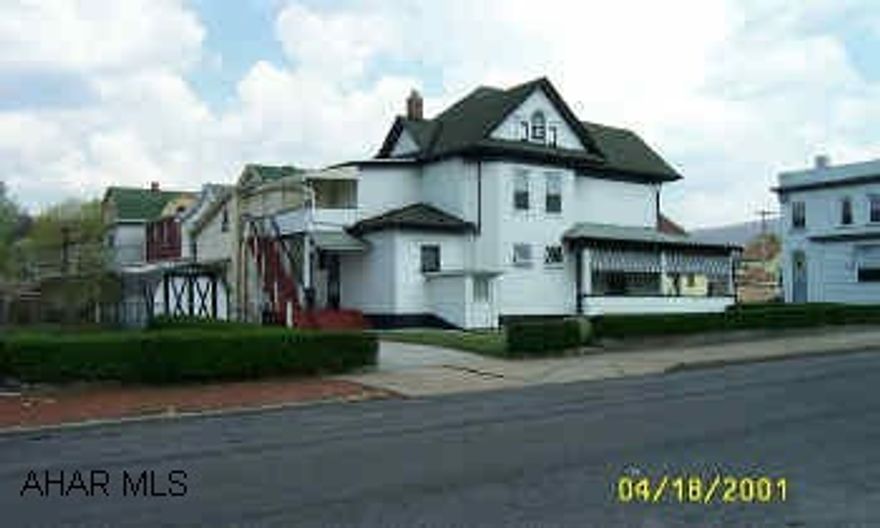 Nicely landscaped, private drive & huge shed.  Wrap around porch, covered back porch & covered balcony. Upstairs appliances stay, 1st floor stove stays, washer & dryer in basement stays.  Included Shed, 2 stoves, refrigerator, washer, dryer, (2) ac units.