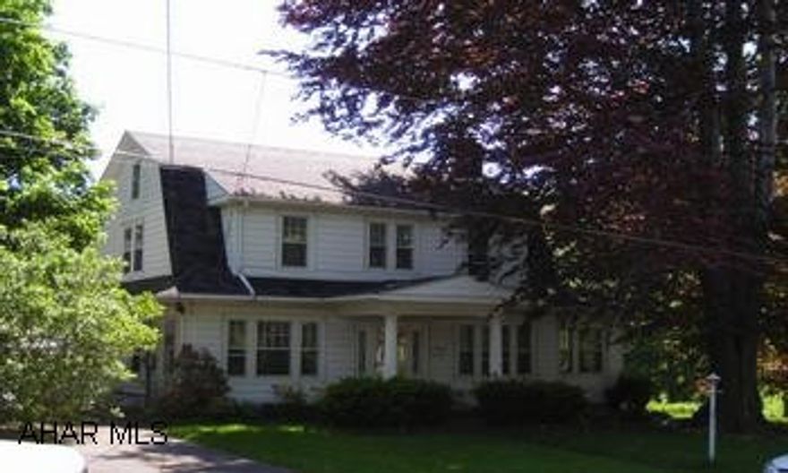 See comments. Truly charming Dutch colonial on extra large lot offers you plenty of room and much convenience - everything within walking distance!!  9' ceilings, original woodwork, hardwood floors, original dining room and living room chandelier, woodburning fireplace in livingroom, sweet all season room off living room.  Half bath first floor.  All 3 bedrooms up along with a full bath.  Roof replaced in 2005, chimney flu inspected 2005, pull down attic access - attic is floored, updated electrical.  Plenty of perennials, stone patio, old fish concrete fish pond.  Partially finished and walk-out basement.  Smart buy - this is a home that anyone would want!