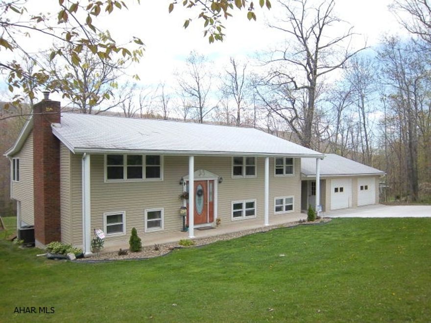 Beautiful 3 bedroom bi-level in serene location in Sinking Valley on .8 acres. Almost everything has been replaced and it shows. Wonderful open eat-in kitchen leads out to expansive deck. MBR has 1/2 bath. New septic in 2004. Brand new concrete driveway leads to oversized two car garage. Bonus/fourth bedroom in lower level needs to be finished as well as lower level bath. All mechanics including roof, heat pump & plumbing since 2004.  Priced to SELL!  Contract with immediate wipeout.