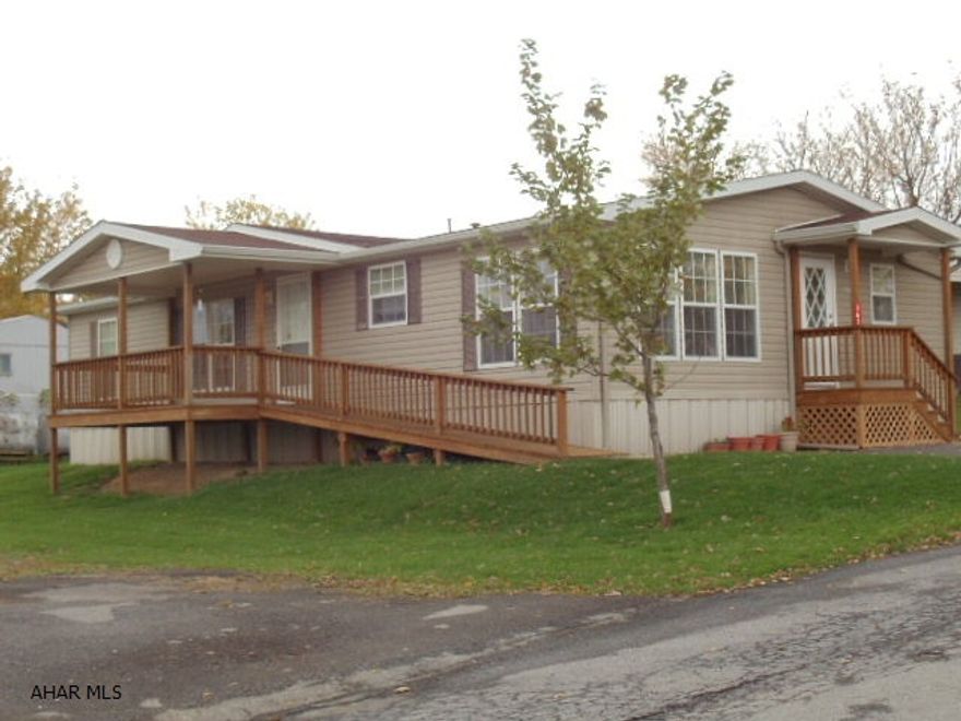 Great view of ducks swimming on pond and nice mountian view! Immaculate 3 bedroom, 2 bath doublewide, spacious kitchen, vaulted ceilings, central air, new deck and ramp. Fuel type is Kerosene. #J-102