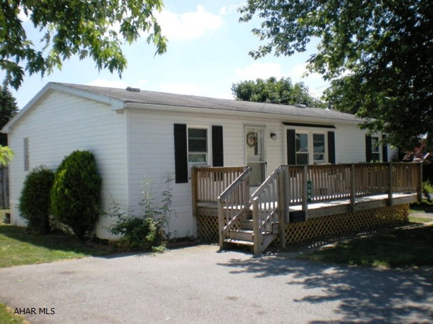 Well maintained and priced to sell; 3 bedrooms, 2 Bath, 1997 Redman Double Wide with front and rear decks on a leased corner lot.  The Master Bedroom has a full bath (vanity with sink in separate area) and a large walk in closet.  Privacy is offered with 2 Bedrooms and a full bathroom located on South Side of the home.  The Eat-in Kitchen, Dining and Living Room feature spaciousness and vaulted ceiling. New thermo pane (UV Glass) windows with oak casings installed in 2012.  Lot rent of $180 per month includes trash removal.