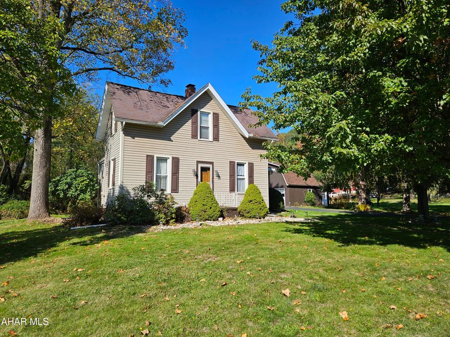 This charming home is nestled in a wonderfully quiet neighborhood, perfect for its next family! Well-maintained, it features a convenient main floor bedroom along with a half bath, three-quarter bath, and laundry room. The spacious kitchen is complemented by both a formal dining room and living room, plus a huge family room addition that opens to a large deck—ideal for entertaining or relaxing. Upstairs, you'll find two additional bedrooms and a full bath. The property sits on a generous 0.6-acre flat lot, providing ample outdoor space. A long paved driveway leads to an oversized two-car garage with a second floor for additional storage or studio!