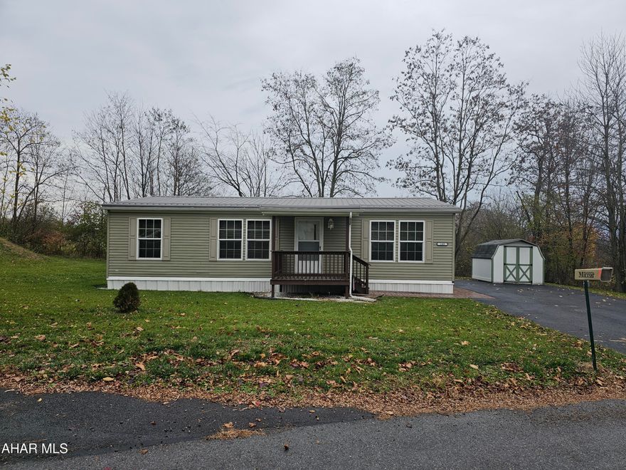 Nice level lot with wooded backyard. Has brand new roof, all new flooring, two plus car parking and storage shed on property. There is a front and a back porch. All brand new appliances with open floor plan.  Like new!
All adults must complete application for Willowbrook Mobile Home Community.