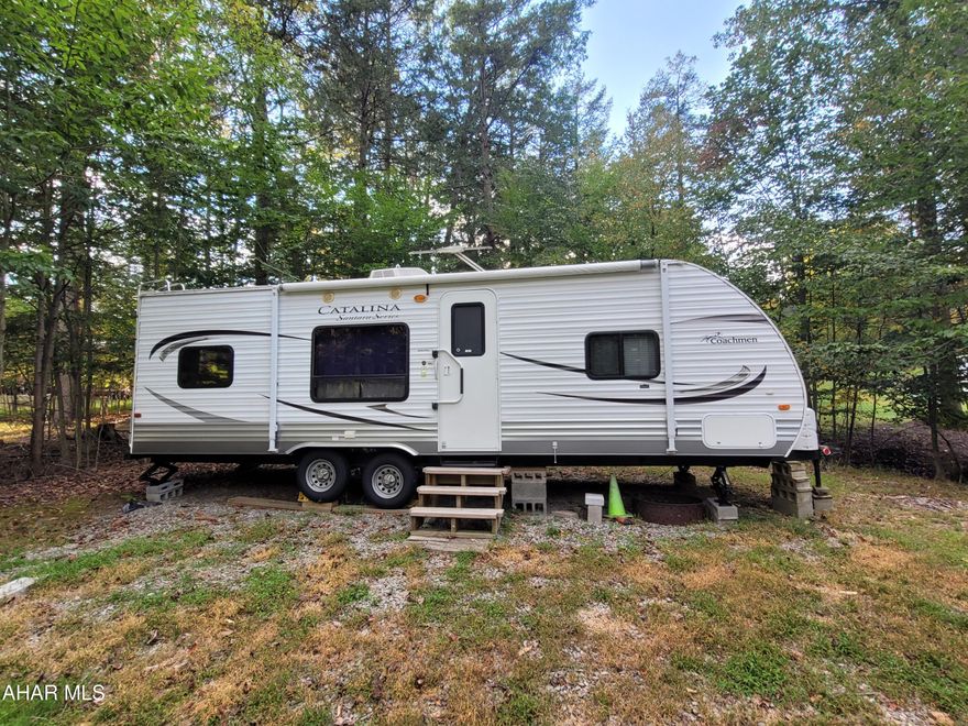 Location is so important when camping.  This campsite is nestled in a private section and across the road from a wooded area.  The camper has two bedrooms or use the second bedroom for added living space.  A shed offers room for your outside storage needs.