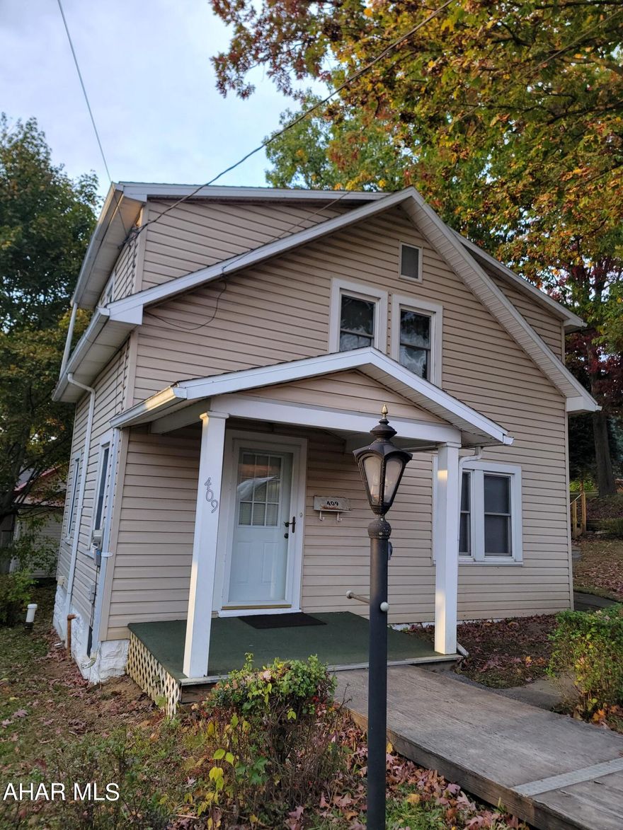 This two story, vinyl sided home is walking distance from Lakemont Park and People's Natual Gas Field, but without the noise of traffic that you'd expect in the Lakemont area! On the first floor is a nice sized living room, a dining room featuring a built in cabinet for storage, and the kitchen with easy access to the basement for laundry. The second floor has a full bath, two bedrooms, plus a bonus room for storage or closet space. This home has a great side yard trimmed with shrubbery for a bit of privacy from the alley and road, plus a shed for your outdoor and lawn care maintenance items. If you're looking for a home that you can modernize and update to suit your needs, this is the one for you!