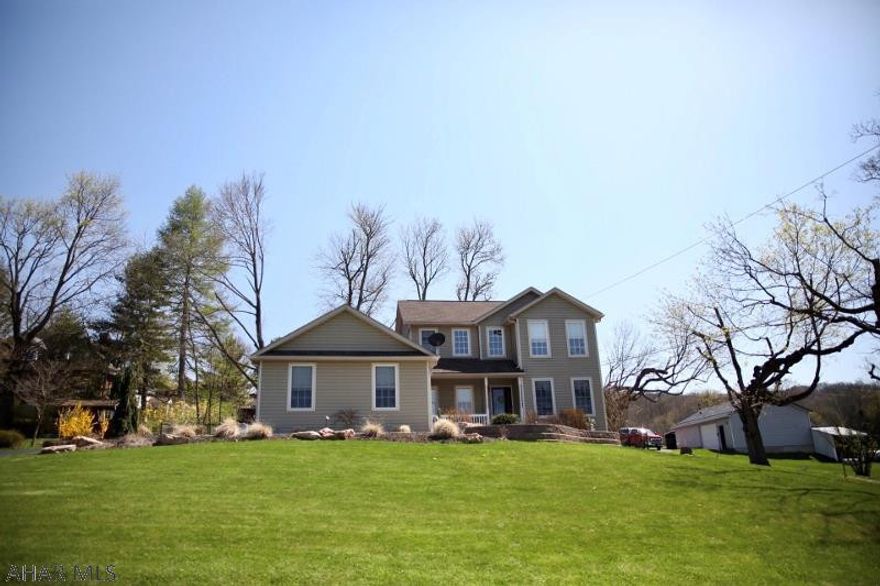 Beautiful 4 BR/4BA home in a terrific in-town location. The first floor offers an open concept living, dining and kitchen area, a master suite, convenient laundry area and a delightful sunroom. The second level offers three bedrooms and a full bath.  The nicely finished lower level is equipped with a gas fireplace and half bath. The professionally landscaped exterior includes a front porch w/mountain view, a fully, fenced rear yard with a patio and a convenient storage shed. A two car garage adjoined by a large parking area complete this energy efficient home which is located only 2 blocks from the Bedford Heritage walking trail.