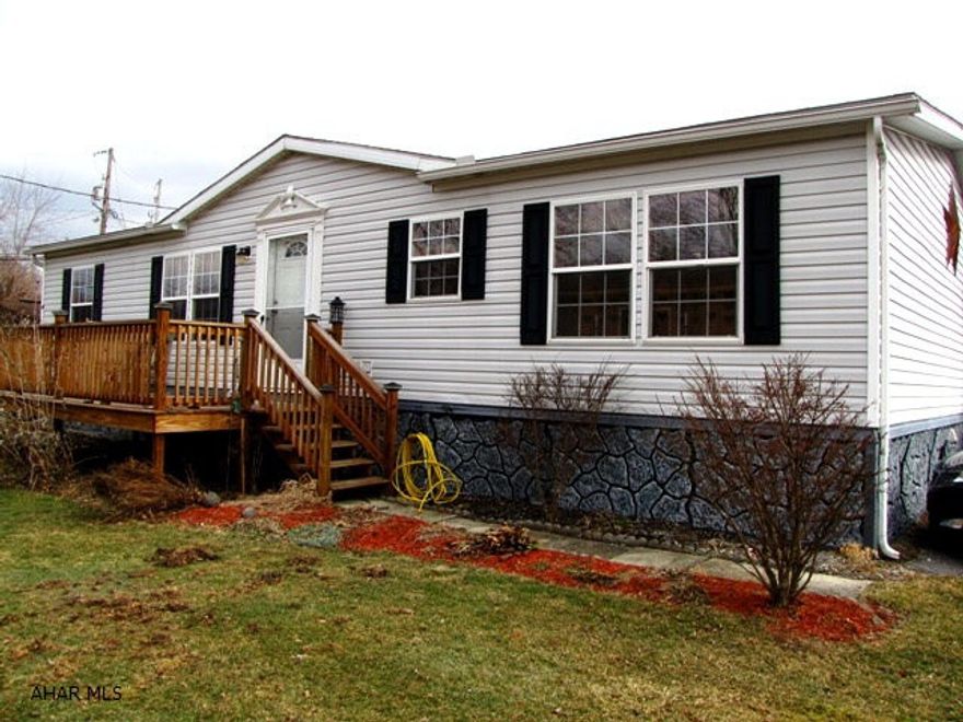 Well maintained, ready to move into. Large rooms with open floor plan to kitchen, dining room and living room. Walk in closets, vaulted ceilings, whirlpool tub in Master Bath. Huge eat in kitchen with oak cabinetry and appliances. 10 X 20 Deck. 48 X 26 Double wide Champion built 1999 on rented lot $180.00. Very nice home. Can't beat the price. Great location. A must see.