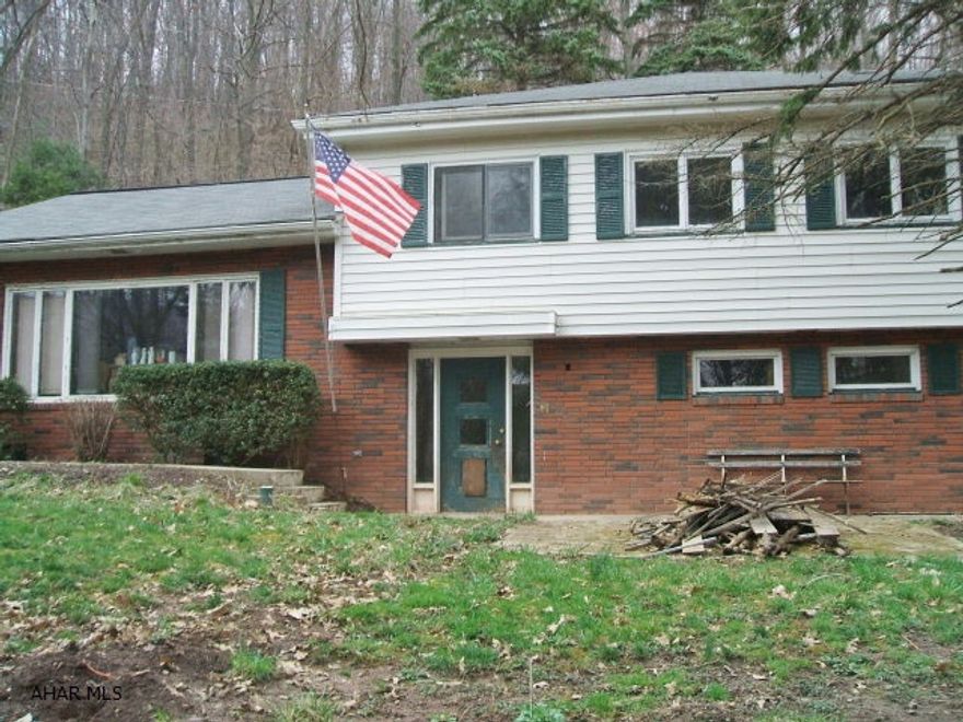 So much potential for this 3 bedroom, 2 bath multi-level. Great location, wooded setting. Needs TLC. Priced to sell, won't last!