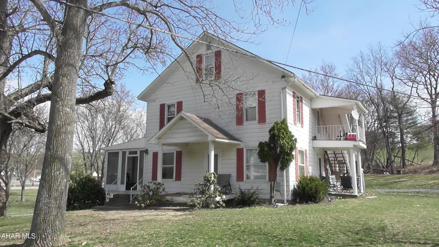 Two-story farmhouse in Chestnut Ridge School District. Four bedrooms with two baths. Country living with easy access to town. Large lot includes a small stream.  Currently a two unit rental, but could be used as a single-family home.