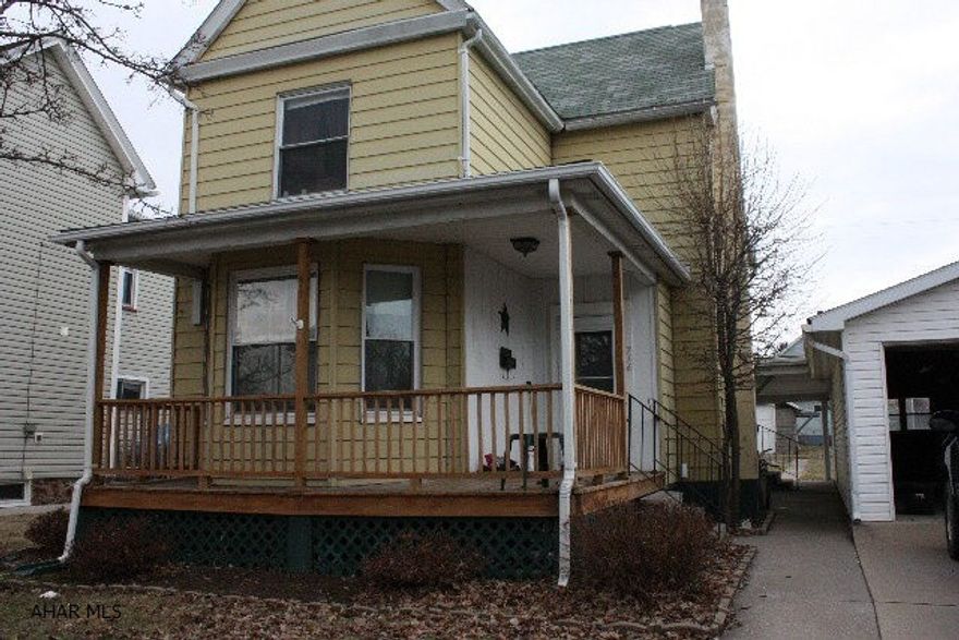 4 bedrooms in Bellwood.  Covered concrete area behind house for entertaining.  Large rooms.  Oversized garage fits 2 cars for convenient offstreet parking. Large lot and yard.  Ready for your finishing touches.