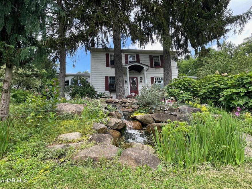 Discover your dream home on Avalon Drive- a 2.5-story house situated on over 6 acres of captivating land. With its hardwood floors and boundless potential, this property offers endless opportunities to create your perfect sanctuary. Enjoy the tranquility of the landscaped front yard with a serene water pond, while the vast 6-acre lot extends into the heavy wooded hills. Rest easy knowing a shared well agreement is in place. Don't miss out on this extraordinary opportunity—schedule a viewing today!''