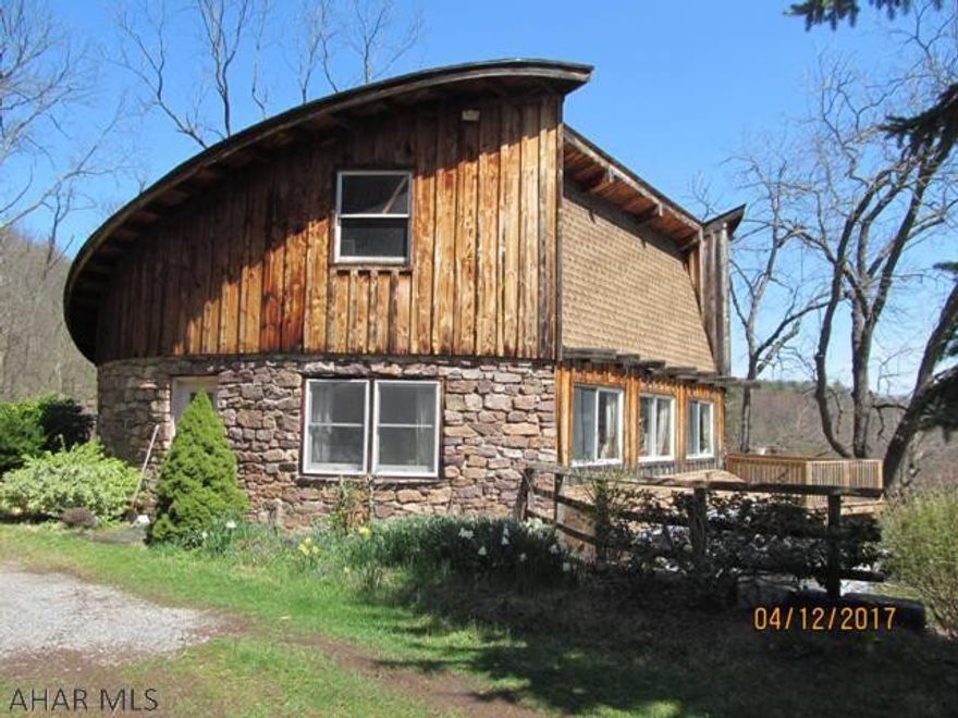 One of a kind! Built from the stone & trees on 46+ acres of open& wooded ground. 3 bdrm, 1 bath w / open concept living area. Deck overlooks pond below. Fenced area for garden w / chicken coop. Small barn. Bordered on 3 sides by hundreds of acres of protected land for hunting & hiking. Recreation, hunting or full time living, your privacy is assured!