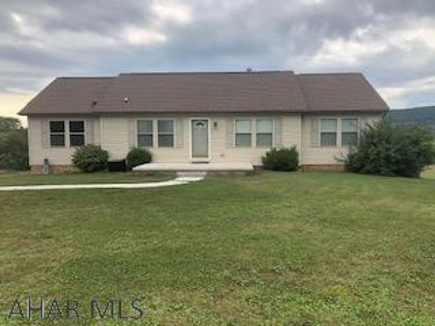 one story home on 1 acre lot with vaulted ceiling, fireplace and built in book case in Living Room.  Island and plenty of cabinets in kitchen.  Convenient laundry off kitchen.  Oil hot water heat and central air.   Unfinished basement has high ceilings and 2 car garage.  Property is sold "AS IS"