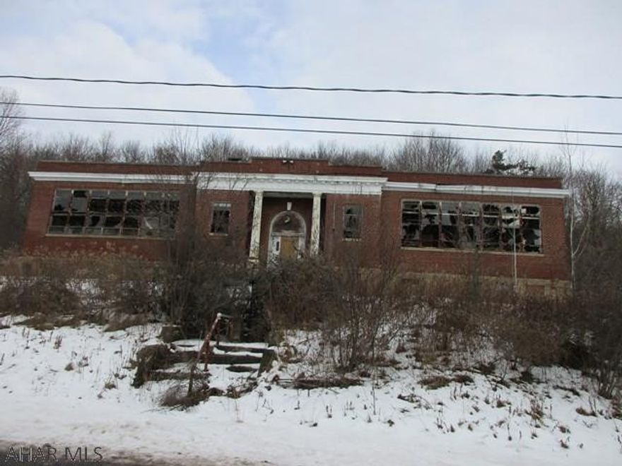 This two acre lot has loads of potential! Building on property needs razed or completely rehabbed.  Demo bid on file.  Zoning is Urban.