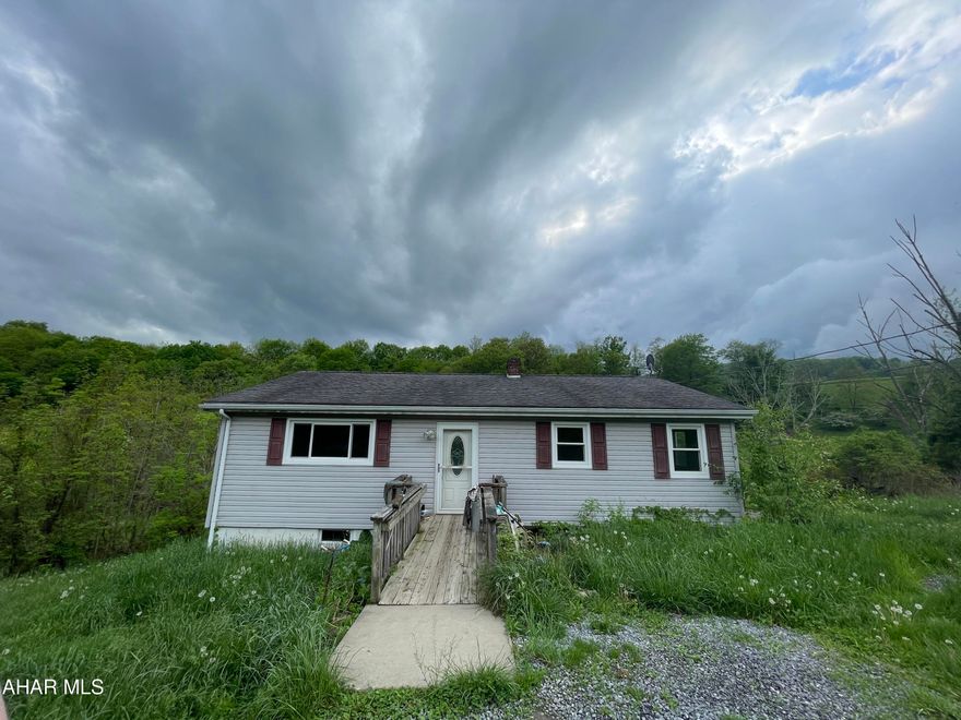 Good bones- Hollidaysburg school district.  One story home offers 3 BR, 1 BA..  and is situated on .53 acres of ground.  Home did fail previous septic dye test.  Needs septic system.  Selling 'AS IS'. The list price already reflects the repairs needed.  Put some time, money, and sweat equity into this and you could have a great home in a desirable location.