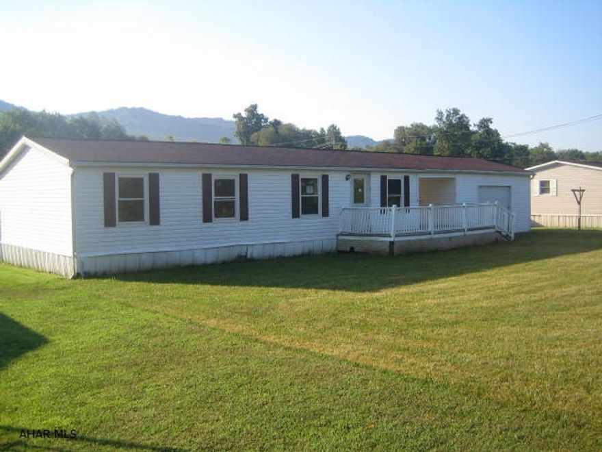 1 story vinyl modular Claysburg home on nice, level lot. Needs TLC, but could be perfect with some work.  Large living room with vaulted ceilings and gas fireplace, spacious kitchen with separate dining area. 1 car garage and large front deck. Buyer pays both transfer taxes.