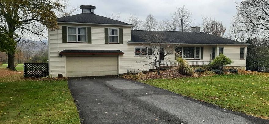 1 1/2 Story Home In Hollidaysburg with a awesome view .. 3 bedroom ( one bd on 1st flr ) , 2 baths, hard wood flrs,  gas fire place, heated sun room, laundry on 1st flr , garage  all sitting on .5 of  a acre.. Dont Delay Set Up A Showing today