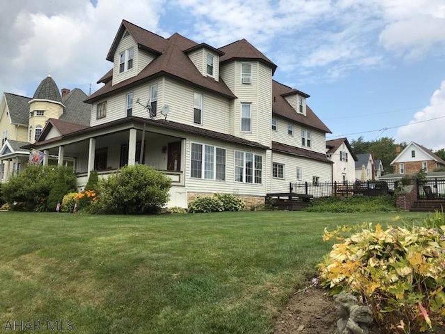 Large stately home in Patton with tons of character. Could be used as a single family home, duplex or triplex. Attached garage.