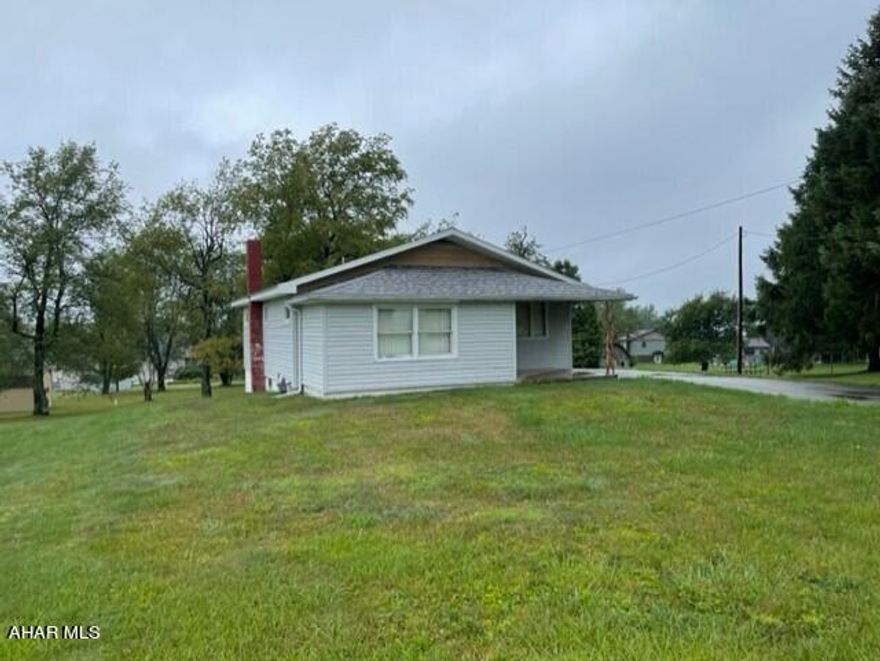 4 BR ranch style located across from Summit Country Club. House has new roof, upstairs and downstairs kitchen, heated sun porch all on 0.8 acre of land