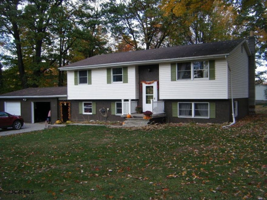 Attractive, large, wooded lot. Bilevel home with large attached garage and breezeway.