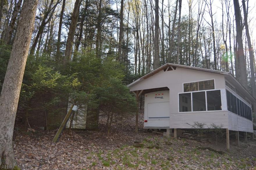 Well maintained,2003 Cougar Camper located on over1 acre of private land.Camper has a screened in deck and a pavilionwith a beautiful view.Great location in Glendale:close to Noelsice cream,State Game Lands, and Glendale Lake.