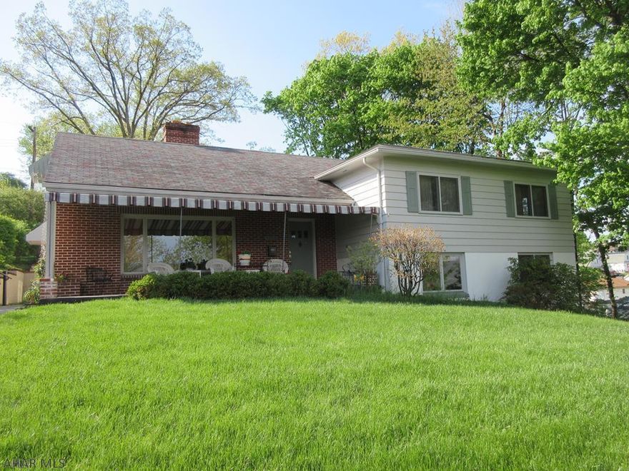 Large Calvert Hills Multi-level split home with room for everyone! You will be impressed with the spaciousness this home offers featuring large formal living room with fireplace, spacious kitchen with dining peninsula and adjoining dining area. 4 large bedroom (plus 1 extra captive) and 2 full bath plus finished basement with half bath that could easily be converted to  bath. Large, relaxing front patio with awning and amazing views! 1 car integral garage and nice back yard.