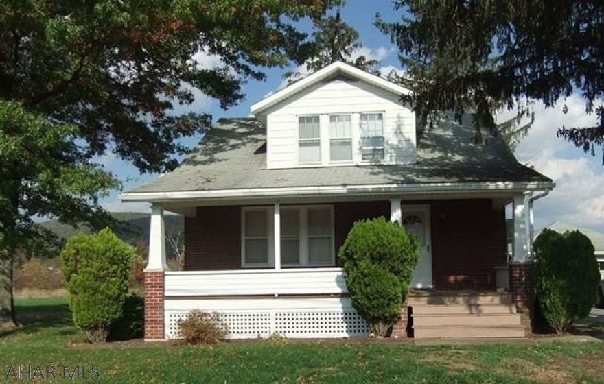 Hopewell 1.77 acre parcel includes brick Cape Cod with detached garage and adjacent commercial building that could be a place of business. Huge potential on main highway with high visibility, easy access and plenty of parking. Needs work and being sold AS-IS. Seller will make no repairs.