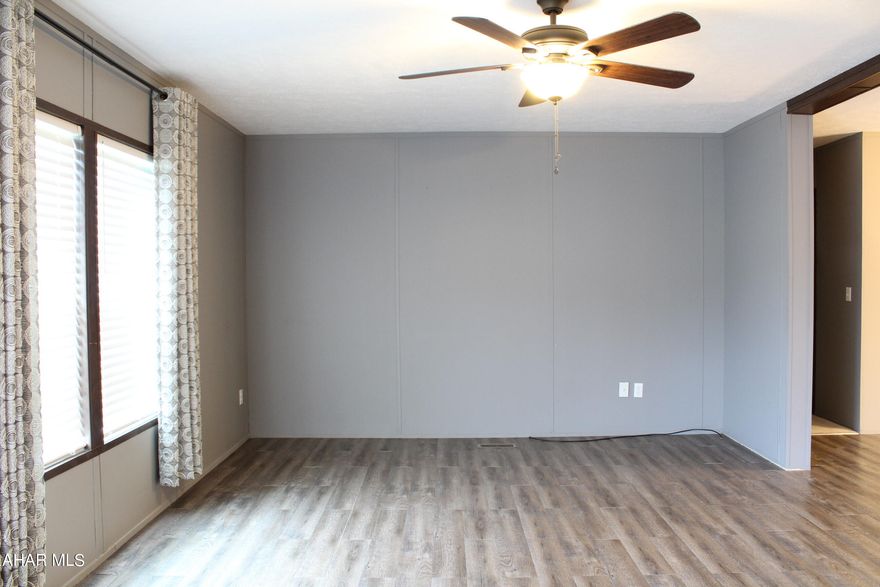 This beautifully manufactured home is a must see with its open floor plan and nice sized bedrooms. The ensuite features a garden tub, 2 sinks, and 2 closets. Beautiful kitchen with island and all appliances included. Central air and a full fuel tank for when the weather turns cold. All new lighting was added . This home is a Must See! It just needs another wonderful family to fill it!!