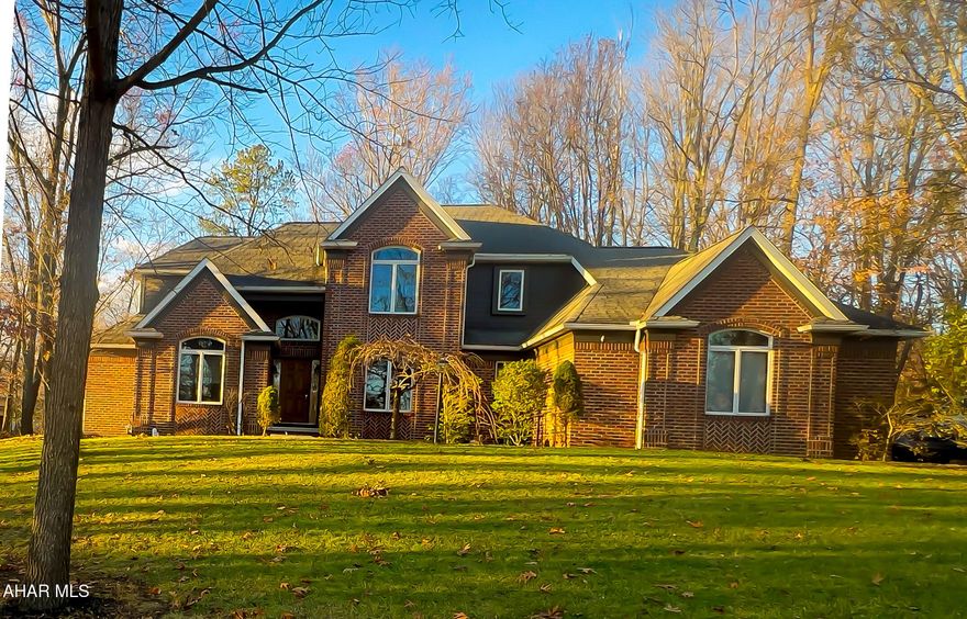 Come see this serene Regency Estates property, offering a perfect combination of privacy, convenience, and luxury on nearly one full acre of level land. Easy access to all amenities, State Parks, l-99 and much more. The first floor features an inviting living room with cathedral ceilings, a spacious formal dining room with recessed lighting and trey ceiling, large eat-in kitchen with visual access to all first floor rooms and entrances, an office/library featuring built in bookshelves, HW flooring and recessed lighting throughout, a Great Room with balcony, fireplace first floor owner's ensuite bedroom and guest powder room. The second floor provides a second private ensuite bedroom with two additional bedrooms and adjoining Hollywood bathroom. Spacious closets throughout, independent HVAC zoning. The full, unfinished basement offers 1800 square feet of climate controlled space awaiting your plans for additional living space. 24 hour showing notice required. Seller/Listing agent is a licensed Pennsylvania real estate agent.