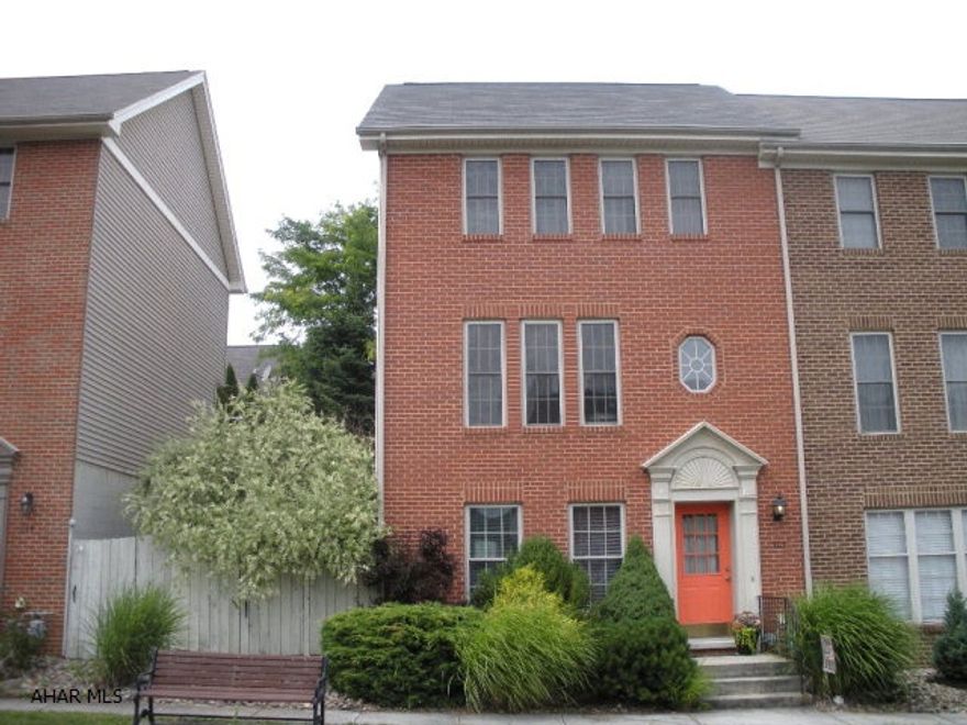 Beautiful end unit town home in Sweet Cherry Court. This well cared for home has a newly renovated kitchen with breakfast bar, new stainless appliances that stay with the home.2 bedrooms. 1.5 baths, open floor plan, main level family room plus central AC.  This is a move in ready property, the rear covered deck and beautifully landscaped yard are a great place to relax. there are 2 off street parking spaces and the yard is fenced.