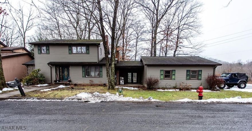 WOW! Location, Location, Location!!!  Great Location with a beautiful view. Beautiful 3 bedroom with 1 1/2 bath. Hardwood flooring. Fireplaces. Finished basement. Off street parking with a garage. Enjoy the back deck during summer evenings. Wildlife in your back yard. Breezeway. There is a first floor laundry. Kitchen appliances stay. Did I mention a beautiful view?? Make this house your home. MOTIVATED SELLERS, BRING AN OFFER!!!