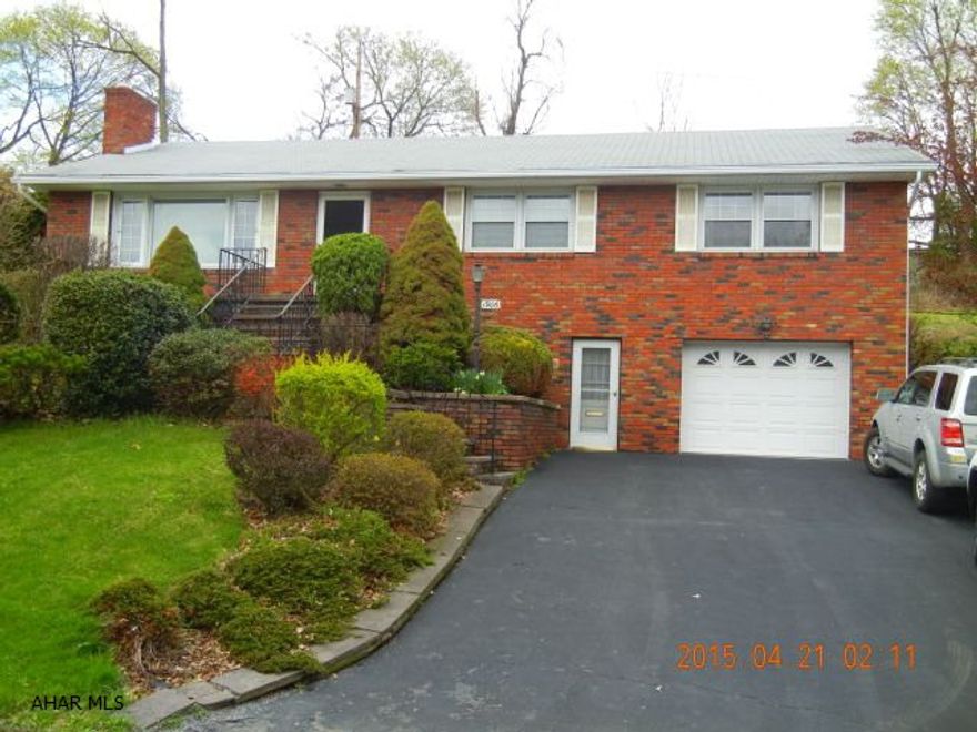 Great home on 100 x 120 lot, 2 complete kitchens, 2 full baths, large living room, eat-in kitchens, 3 bedrooms, large family room in basement with fireplace, dining room, bonus room, 1 stall integral garage, large screened in rear patio, and security system, and a wet bar. Agent is related to seller.