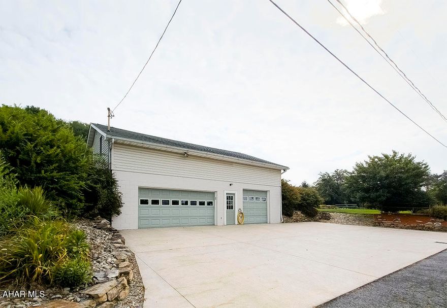 This approx half acre property can be purchase by itself or in conjunction with a house which includes 2 additional lots.  This lot features the following:

Large Detached Garage with Loft
The garage has plenty of space to work on and store vehicles.  There are 2 propane heaters and a wood burner for heat.  There is also water connected to the garage.  The second floor is perfect for storage or it could be converted into living space.

1-Car Detached Garage
Offers additional storage.  Outdoor kitchen located adjacent (sink and water heater included but currently winterized and not connected)

Additional Features
Functioning outhouse conveniently located on the opposite side of the lot and storage shed for tools, equipment, or seasonal items