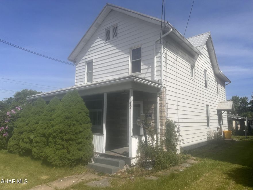 Portage- 2 story 4-5 Bedroom  1 3/4 bath home on large corner lot.  Gas, hot water radiator heat.  First floor laundry.   24' x 40' detached  garage.  Wraparound front porch.