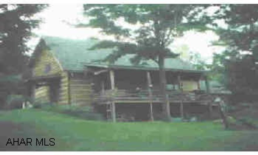 Remarkable log home in ideal private setting. Separate living area on basement/1st level of home offering Living Room, Bedroom, Kitchen and full bath. Make sure you see this great property. Remarkable log home in ideal private setting. Separate living area on basement/1st level of home offering Living Room, Bedroom, Kitchen and full bath. Make sure you see this great property.  Vaulted ceilings.