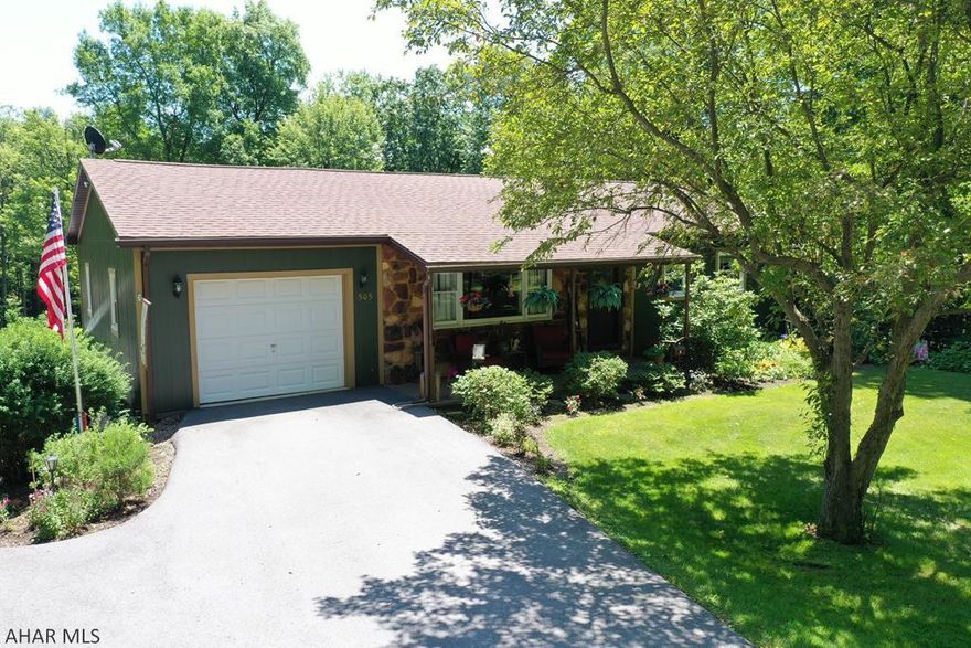 This updated raised ranch home is a rare find, situated on almost one and a half secluded acres and surrounded by woods  The home offers plenty of privacy while remaining close to I-99 for an easy commute.  On the main level, you will find a spacious kitchen with included appliances and plenty of cabinet space, formal dining room, living room, 2 large bedrooms, and a full bath. A covered deck off the kitchen overlooks the yard which is great for entertaining guests or simply admiring the wildlife.  In the basement, you will find an additional living area, bar, wood burner, workshop area, 1/4 bath, and laundry room.  There are two garages plus a large shed as well.