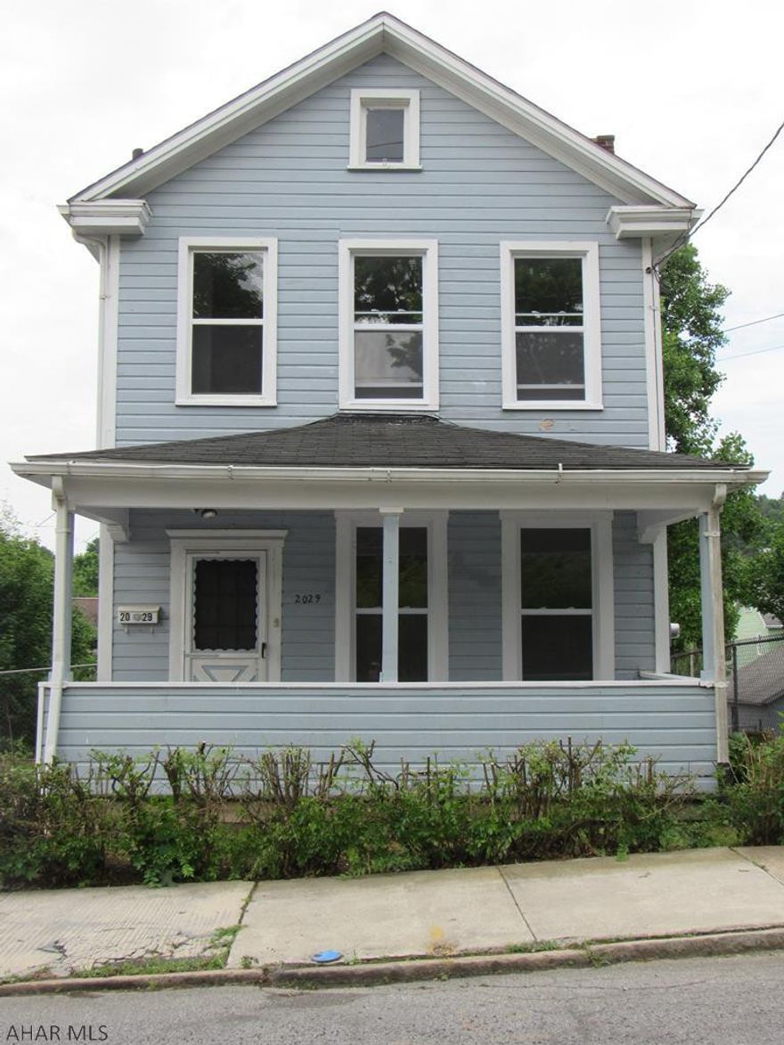 This house is priced right to sell fast! It is on a double lot and is move in ready for the new home owner or the investor that can start earning rental income immediately!  New carpet through out, laminate flooring in foyer, and newer windows provides lots of natural light. Great covered front and rear porch. Plenty of off street parking. Access from the alley behind enables you to add a garage or add more parking. Investors call for a showing today, you will be glad you did!