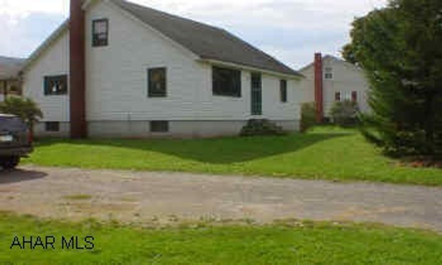 This "cape cod" has the potential to be everything you want it to be and all on a lot that is over an acre.