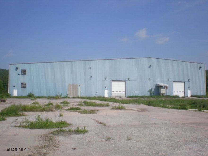Stanley metal building approx 20' high and insulated. Built in 1995 contains 41,000+ sq ft. Concrete floor. 3 ten ton cranes. Additional buildings include office building, 40x80 metal building 35' high, 18,080 sq ft stockshed building, 30x53 machine shop etc. Gas well on site with gas rights included except for 2.75 acres. Public water/sewage. Unbelievable value.