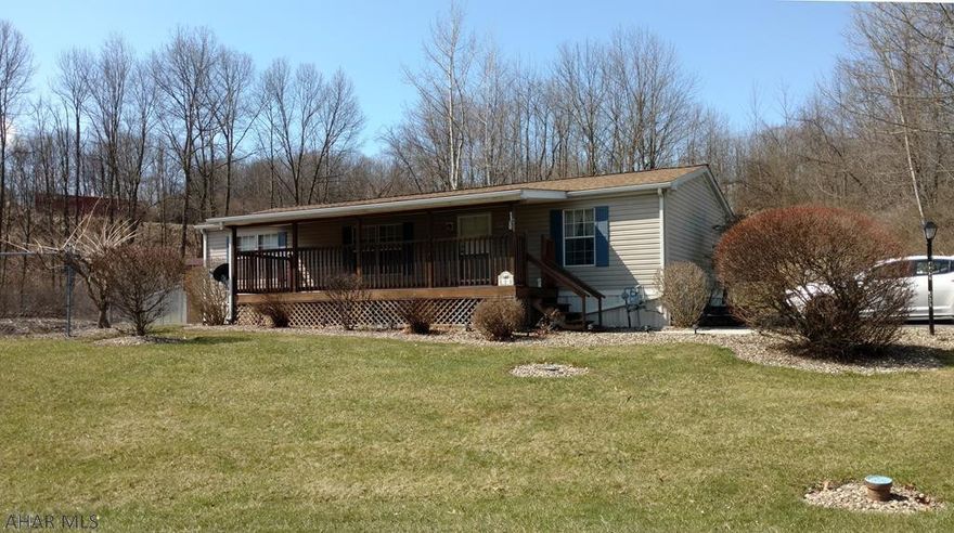 Very well maintained 1999 Redman Double Wide Mobile Home (new roof, skylights and skirting June 2017). The vaulted ceilings create a spacious appearance and the split floor plan provides privacy for family member and or guests.  Master Bedroom has a large adjoining Master Bath featuring a Garden Tub, Walk In Shower and Skylight. Other amenities; large Eat In Kitchen, Central Air, an exceptional 27' x 8' covered deck and paved parking space large enough for 2 cars .  Lot Rent is $368 per month and includes Trash  Removal and Snow Plowing. The home is located in Camelot Woods MHC which requires an approved application for lessees and occupants and a fully excited lease prior to new owners being able to reside in the community.  Seller is motivated and will consider all reasonable offers.