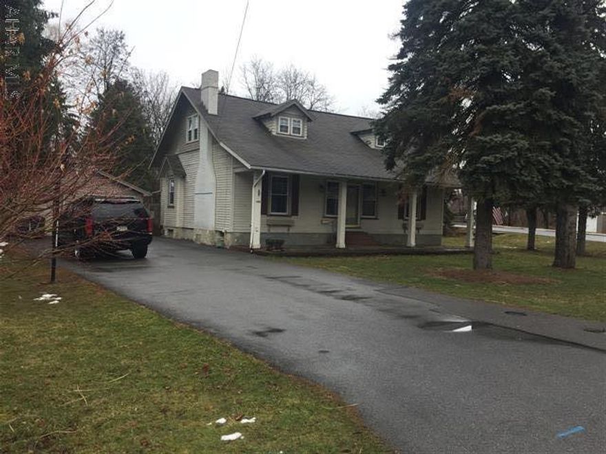 Entertain in this elegant living and dining area. Beamed ceiling, fireplace and hardwood floors are just the beginning. 5 bedrooms, 2 full baths, 2 car detached garage, central air, large level yard. Relax by the pool in privacy. Immaculate, freshly painted, storage galore.