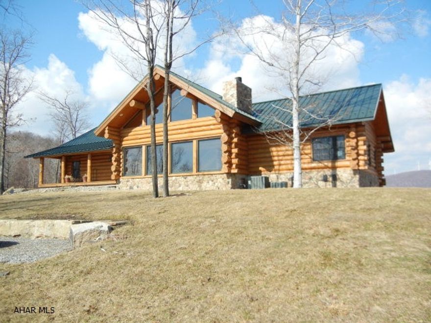 This magnificent, one of a kind Western style full log home is a very rare find in Pennsylvania.  Built in 2006 and took two years to complete.  The 5,000 square foot handcrafted and Scandinavian full scribe style home.  The home is conveniently located in Logan Township in Altoona,PA.  It sits majestically, high atop 40 private acres with breathtaking views of Lake Altoona on one side and Hollidaysburg on the other.  It is bordered by thousands of acres of Altoona City Water Authority property.  This is privacy and tranquility at its very best, yet only 10 minutes from the Logan Valley Mall.  High end amenities throughout the custom designed, open floor plan make this truly a magazine quality dream home.  Possible short sale.