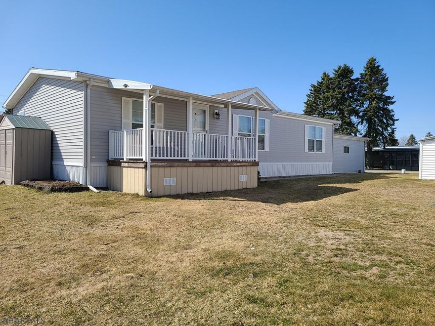 Rare Find: Well maintained doublewide with an attached 2-car garage in the Wise Trailer Park...across from the mini mall in Ebensburg.  The lot rent is $230.  If you pay by the 5th of the month, you get a $20 discount.  The lot rent includes water, sewer and trash.  If you want your driveway plowed, they charge $10.  There is a separate building for all residents to get their mail, however, there is a box on the exterior of the doublewide to receive your newspaper.  Features include a covered front & back porch, attic storage in the garage, central air, all appliances, quality window shades, draperies, a nice entertainment center in the living room and a home security system.  55+ Community, No Dogs Allowed.  They permit 1 cat.  You must fill out an application to lease the lot.