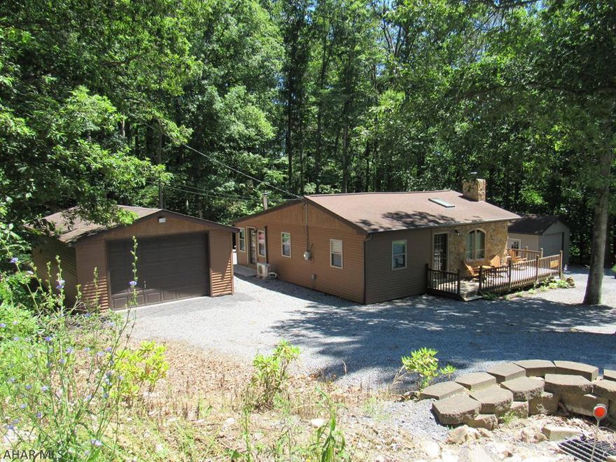 Everything is on your checklist when looking at this bright & spacious cabin and it is within short proximity to 4 public boat launches; AITCH,James Creek,Tatmun Run & Shy Beaver.  Easy maintenance, move in ready, & a place for the boat. At the end of the day entertain your friends in the sunroom,at the fire pit or under the covered patio.The seller is conveying most furniture, & linens making this a turn-key opportunity.This meticulously maintained renovated home is situated on 1.32 acres and offers a great location for a vacation home or year round living.The front porch invites you to sit and enjoy the evening stars.  The lower level can provide for additional guest sleeping quarters and it has a kitchenette!  So pack your bags and enjoy Lake Raystown! Boat Garage 30'6"x18'6"