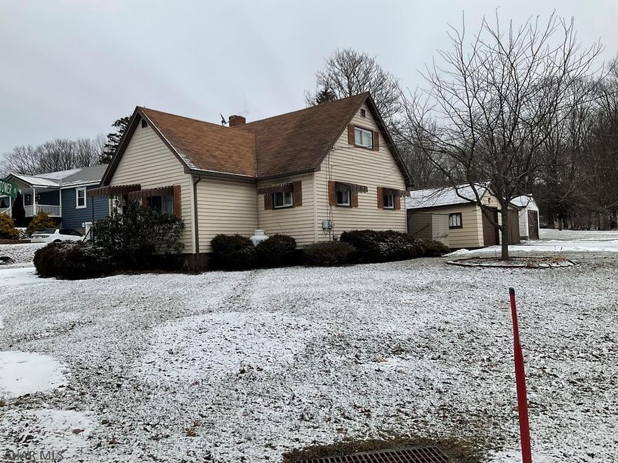 Sweet & Cozy Home out of the hustle & bustle of the City, but close enough to shopping. Not too Big-Not too Small it's just right!  2-3 Bedrooms. Laundry on the main level. Lots of Storage Space, 3 Season Porch, 2 Car Garage. Covered Pavilion for entertaining. All on almost a half Acre! Private and Quiet. A must see! This is an AS IS SALE.